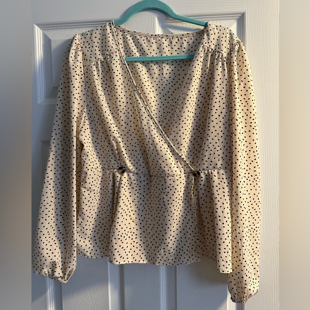 Cream color base with black polka dot blouse.